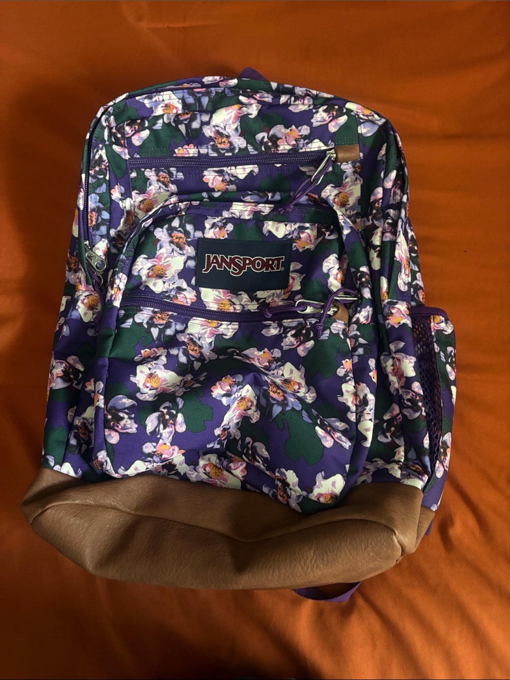 Jansport Purple Floral Backpack with Green Accents and Brown Base